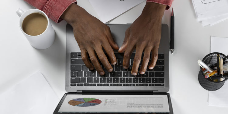 top-view-hands-typing-keyboard